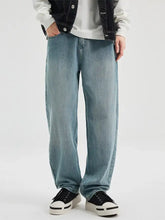 Men’s wide leg jeans in light-wash denim with a relaxed straight-leg cut for comfortable casual wear