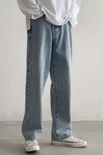 Men’s light-wash denim wide leg jeans with a relaxed straight-leg cut and classic stitching details