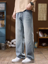 Men’s wide leg jeans in light-wash denim with a relaxed straight-leg cut for casual wear