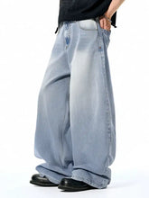 Men’s wide leg jeans in light-wash denim with ribbed texture and faded detailing for a casual look