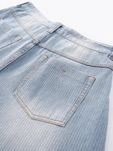 Men’s wide leg jeans in light-wash denim with subtle ribbed texture and reinforced stitching for durability