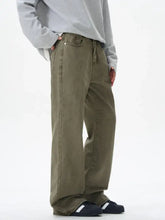 Olive green wide leg denim pants for men featuring a relaxed fit and durable cotton material