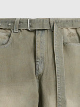 Men’s wide leg olive green denim jeans with subtle distressing and a silver-toned belt buckle detail