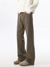 Men wide leg olive green trousers with relaxed fit and subtle side seam detailing in wide leg denim style
