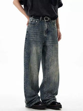 Men’s wide leg jeans in washed denim with a faded blue wash and distressed details