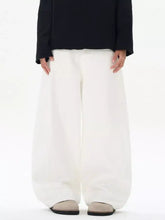 Men’s wide leg jeans in white with a relaxed flowing silhouette and wide-leg cut for minimalist style