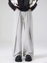 Men’s light gray wide leg jeans with relaxed fit and subtle pleats down the front for casual wear
