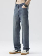 Men’s wide leg jeans in dark-wash denim with a relaxed straight-leg cut and classic five-pocket design
