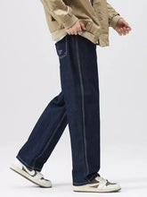 Dark blue denim men’s wide leg jeans with white stitching and embroidered logo on the back pocket view