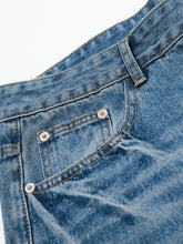 Mens wide leg relaxed fit denim shorts in light blue with silver rivets