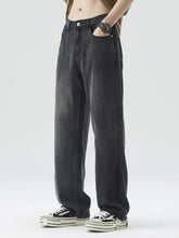 Men’s wide-leg relaxed fit jeans in dark-wash denim with a straight-leg cut and visible stitching details