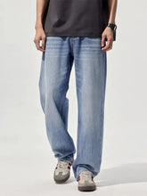 Light-wash denim men’s wide-leg relaxed fit jeans with a straight-leg cut for casual wear