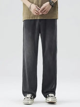 Men’s wide-leg relaxed fit jeans in black denim featuring a straight-cut silhouette for casual wear