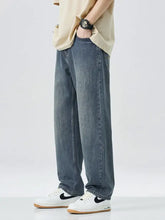Men’s wide leg relaxed fit dark-wash denim jeans with a straight-leg cut and subtle fading fit jeans
