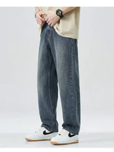 Dark-wash denim men’s wide leg relaxed fit jeans with a straight-leg cut for comfortable everyday wear