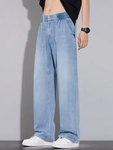 Men’s wide leg relaxed fit light-wash denim jeans with an elastic waistband in a comfortable casual style