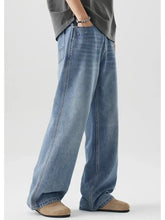 Men’s light-wash denim wide leg relaxed fit jeans with classic stitching and a straight-cut silhouette