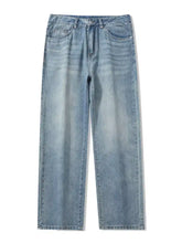 Men’s light-wash denim jeans with relaxed fit wide leg cut and classic five-pocket design