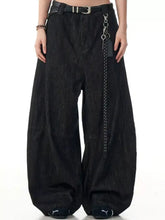 Men’s black wide leg wash denim jeans with chain accessory hanging from the belt loop