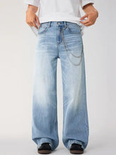 Men’s wide leg wash jeans in light-wash denim with a silver chain detail on the front pocket