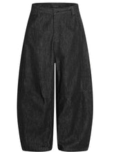 Men’s black wide leg wash jeans made of denim with a high waist and relaxed fit for comfortable wear
