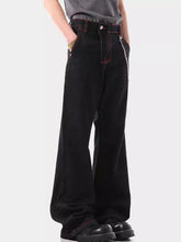 Men’s black wide leg wash denim jeans with red stitching and silver chain detail on the side seam