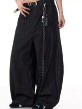Mens wide leg wash jeans in black denim featuring a silver belt buckle and side chain accessory