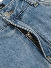 Men’s wide leg wash jeans in blue denim featuring a silver button and zipper for a classic leg wash jeans style