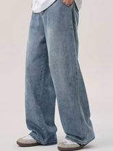 Men’s light-wash denim wide leg jeans with relaxed fit and visible stitching detail for casual wear