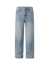Men’s light-wash denim wide leg jeans with a relaxed straight-leg cut and subtle distressed details