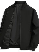 Black men’s zip up long sleeve jacket with sleek modern design and subtle stitching details