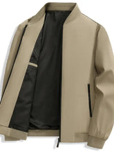 Men’s beige bomber long sleeve jacket with black interior lining and zippered pockets for casual wear