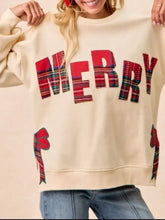 Cream oversized sweatshirt with bold red plaid merry lettering and matching ribbon appliques made of slightly stretchy material machine wash cold