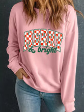 A soft pink merry and bright graphic christmas long sleeve sweatshirt with slightly stretchy fabric machine wash cold tumble dry low
