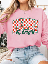 Pink slightly stretchy long sleeve sweatshirt with merry and bright red and green checkered print machine wash cold tumble dry low