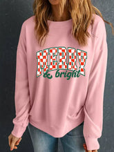 Pink slightly stretchy long sleeve sweatshirt with merry and bright red and green checkered print machine wash cold tumble dry low