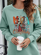 Mint green Merry Christmas graphic sweatshirt with colorful tree patterns