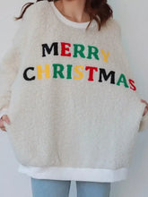 Cream-colored sherpa fleece sweatshirt with merry Christmas print in multicolored letters machine wash cold
