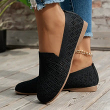 Pair of black mesh round toe flat loafers with tan sole