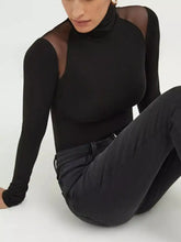 Black mesh shoulder turtleneck bodysuit with sheer mesh panels at shoulders in high-neck long-sleeve design