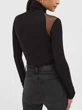 Black long-sleeve shoulder turtleneck bodysuit with sheer mesh shoulder panel shown from the back side
