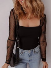 Black mesh sleeve square neck bodysuit featuring sheer dotted fabric with long sleeves and thin straps