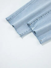 Mid rise ankle-length distressed skinny jeans in light-wash denim with frayed hems and slight stretch for comfort