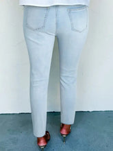 Light-wash mid rise ankle-length distressed skinny jeans with slight stretch and frayed hems for a slim fit look