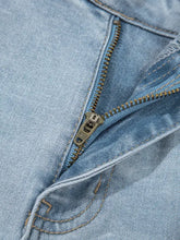 Light-wash mid rise ankle-length distressed skinny jeans with metallic zipper visible stitching and slight stretch