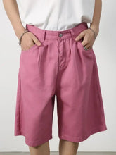 Pink mid rise denim shorts with pleated design, machine wash