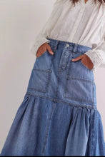 Midi denim skirt with high waist two front patch pockets and tiered hemline in medium blue wash denim skirt