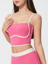 Neon pink Millennia crop top with contrast trim and detachable chest pads