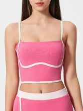 Pink and white Millennia crop top with contrast trim, wavy design, thin straps, detachable chest pads