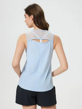 Light blue Millennia cutout back round neck active tank with black shorts